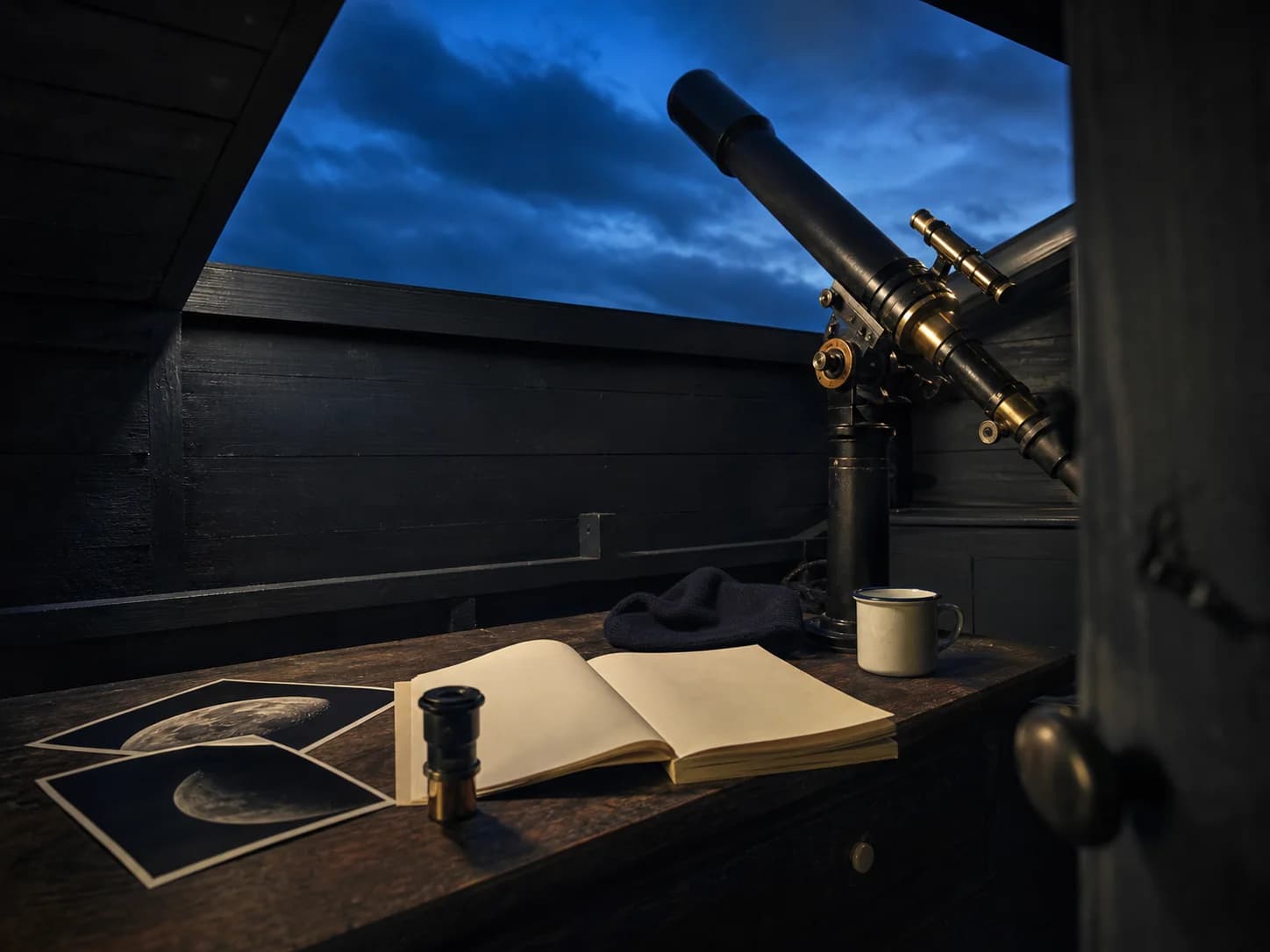 Astronomy observation desk with a Moon map, clock and field notebook